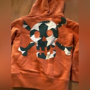 Mini Boden Vibrant Orange Hoodie with Green Lining and Skull and Crossbone Back